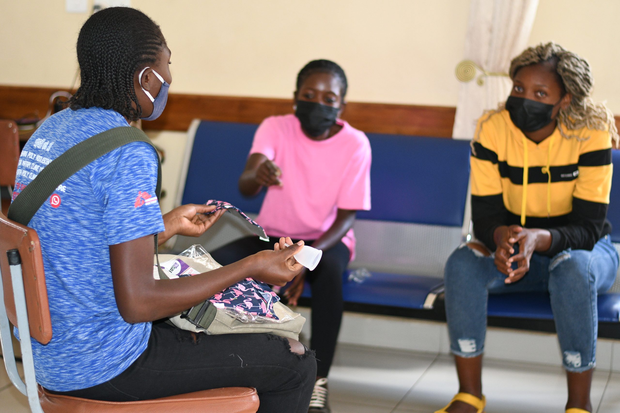 An MSF peer education having a group conversation with young women.