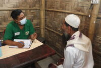 A patient speaks to a health care worker.