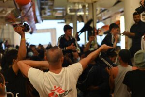 MSF Staff directing survivors during the rescue in the international waters near Libya.