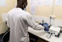 MSF laboratory technician running blood tests in Nametil blood bank in the Mogovolas district.