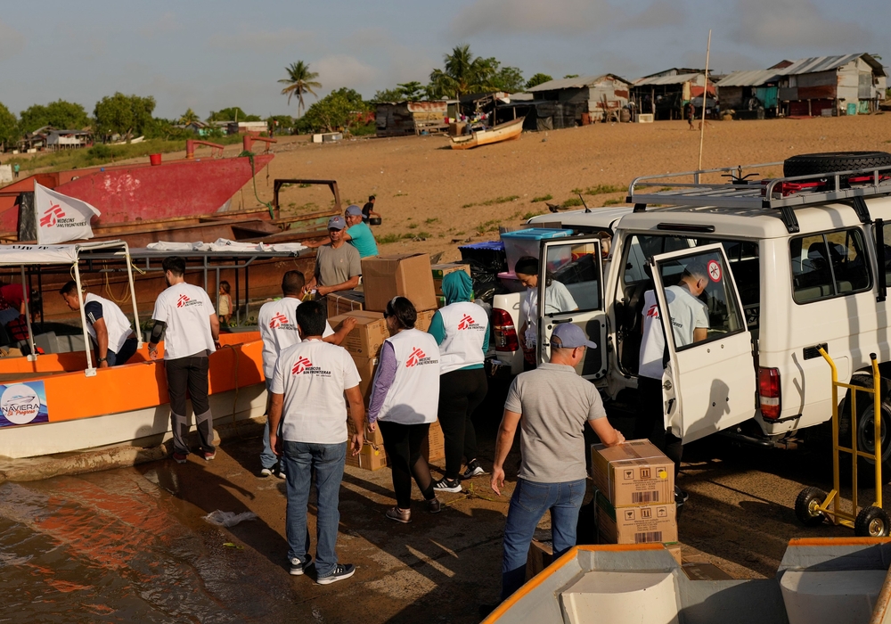 MSF Team members loading medical supplies on motor boats in Delta Amacuro state, north eastern Venezuela.