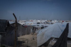 Temporary Refugee tents inside a mesh fence in Al-Hol Camp, Eastern Al Hasakah Governorate.