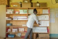 A clinician picking ARVs for a patient at Maram Dispensary in Ndhiwa sub county, Homa Bay County.
