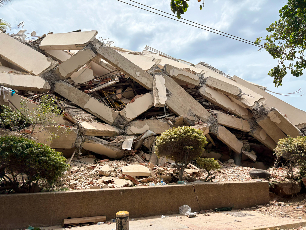 A pile of twisted concrete where a building collapsed following the earthquakes. Venezuela, 2026.