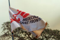 Zoomed in flag flying with MSF logo partially visible